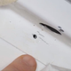 The hole in the Soyuz MS-09 crew vehicle prior to patching with an epoxy-based sealant. Scratches and several false starts at drilling suggest a “faltering hand,” in the words of Roscosmos CEO Dmitry Rogozin.